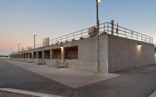 The concrete-walled exterior of a water treatment plant. 