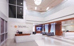 Lobby desks and waiting area at Chandler Regional Medical Center - Tower D building exterior and driveway entry