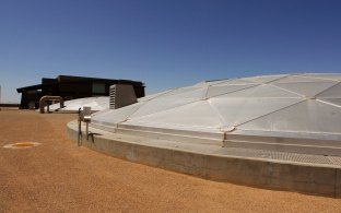 External view of the in-ground covered water tank at Greenfield. 