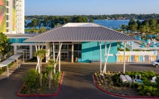 A roof over the drive-up entryway of the resort