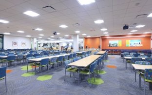 Mayo Clinic Cafeteria seating area with multiple dining tables and chairs
