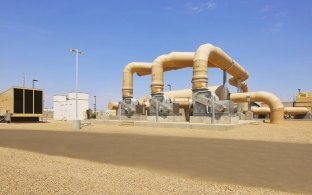 Sand-colored, large diameter piping at a water facility in Mesa, AZ. 