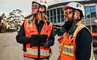 employee on jobsite with iPad