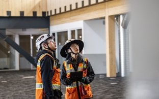 interns reviewing checklist on the iPad