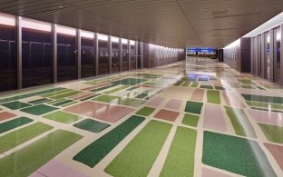 Phoenix Sky Harbor International Airport Terminal 4 Eighth Concourse walkway with multi-colored floor design