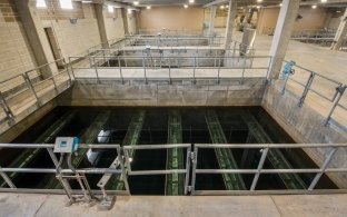 Water and pipes below the building inside the water treatment facility