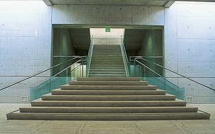Indoor image of wide stairs leading to a second floor