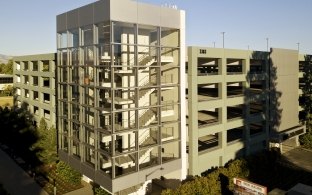 Santa Clara Square Parking Structures exterior glass-enclosed stairwell and landscape