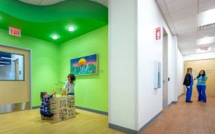 A hallway with two people standing