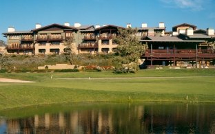 Golf course with the Lodge at Torrey Pines exterior in background