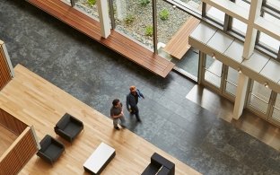 Looking down from upper levels into the first floor common area of the UCSD Biomedical Research Facility