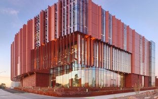 Outdoor image of the building with windows and panels sticking out