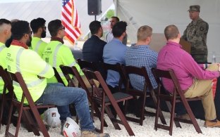 Soldiers talking to an audience.