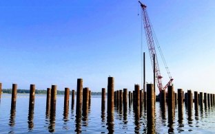 View of piles in the water during construction of the intake pump station