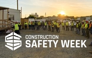 Team of construction workers celebrating Construction Safety Week.