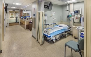 A patient bed with privacy curtain