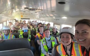 Group of people taking a selfie while on a bus