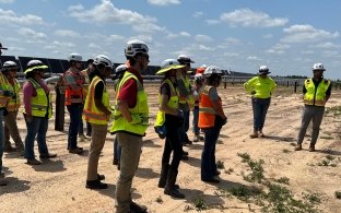 A group of interns on a renewable energy jobsite tour