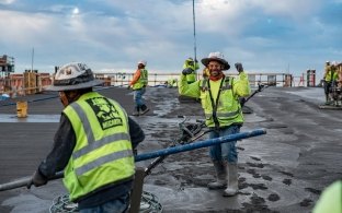 Group of people working on a concrete pour