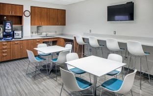 A break room with tables and chairs.
