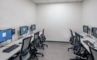 A room with six computer stations