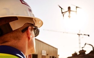 man flying a drone