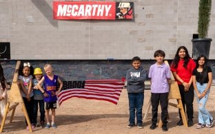 Children from Galveston Elementary standing outside the school