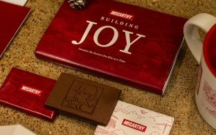 A spread of McCarthy branded holiday goods likes cards and chocolate