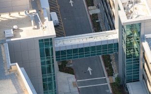 Aerial view of the enclosed pedestrian bridge between two buildings
