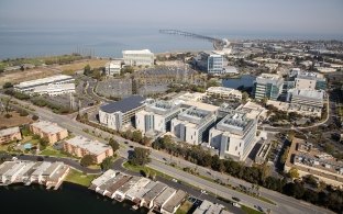 Aerial view of the building with the ocean in the background