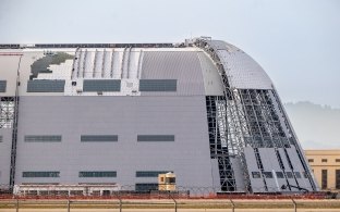 Exterior view of one side of the hangar under construction