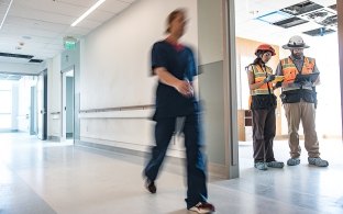 healthcare worker walking down the hall