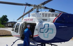 A person looking inside a helicopter