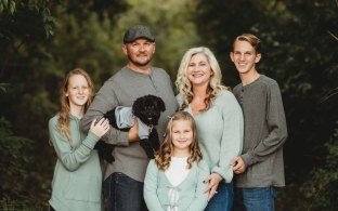 A photo of the Steward Family and their dog