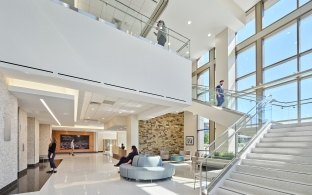 A lobby area with open stairs to the second floor