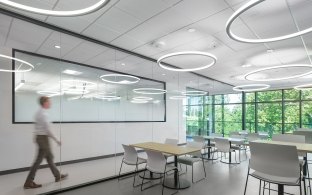 A person walking through a classroom