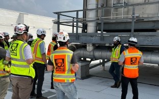 A group of people wearing PPE on a jobsite.