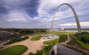 view of the st louis arch, visitor center, and skyline
