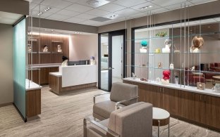 A waiting area with chairs and a small table