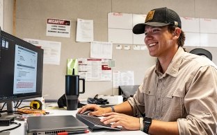 A person looking at a computer screen