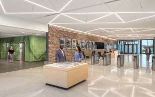 A lobby area with a desk in the middle