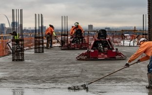 A McCarthy crew on a project with a cityscape view