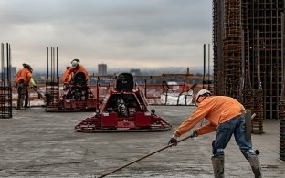 A McCarthy crew on a project with a cityscape view