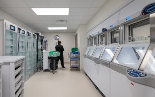 A person standing in a room with medical equipment