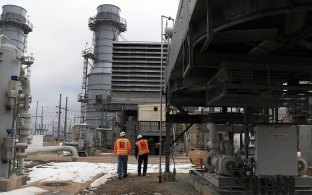 Two people walking on the Ameren Audrain project