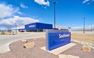 Image of the exterior of the building and a Southwest Airlines sign in the foreground.