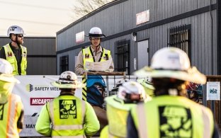 A group of people wearing PPE 