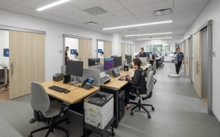 An office area with multiple desks and computer