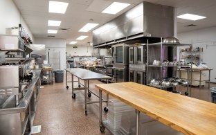 A culinary teaching kitchen with commercial appliances