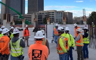 A group of people standing together on a jobsite 